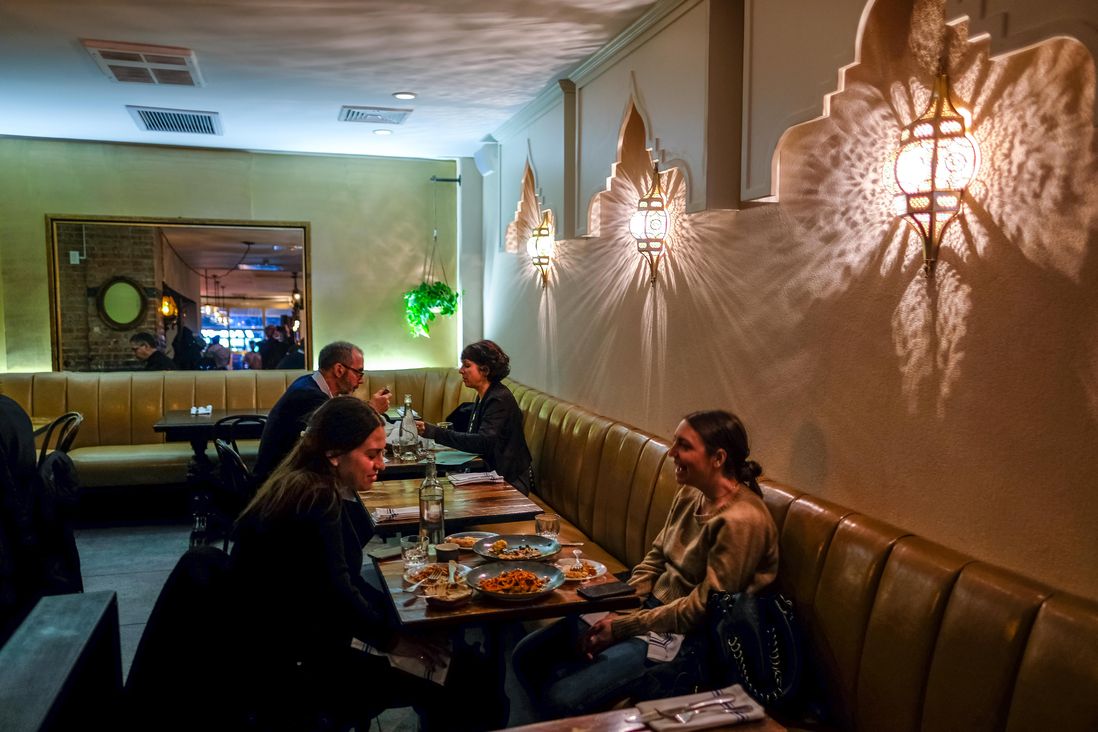 Inside Zizi Limona, photo shows tables and patrons at seats